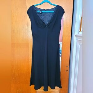 Navy blue formal dress with a beaded collar.